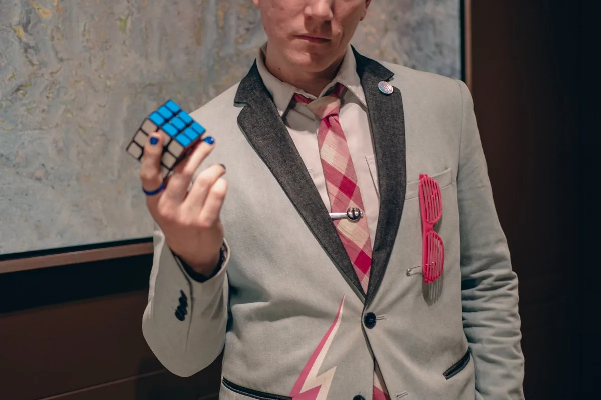 Rubik's cube mid-toss in the lightning bolt jacket