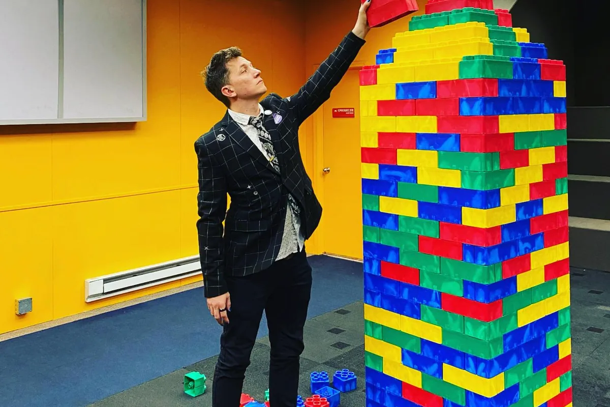 Joe at the Lego event building a giant brick tower